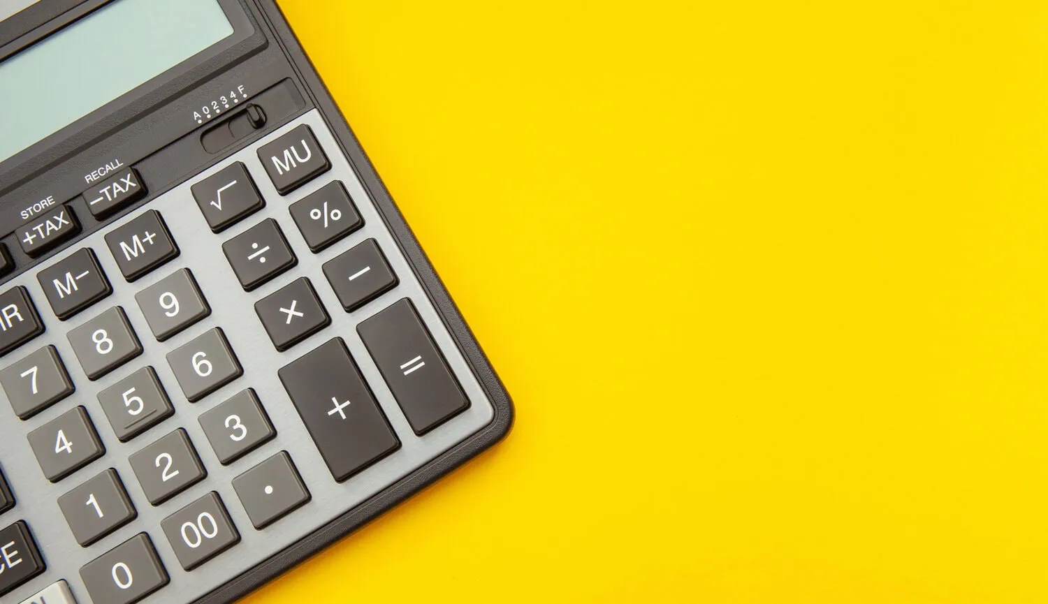 A calculator on a yellow background.