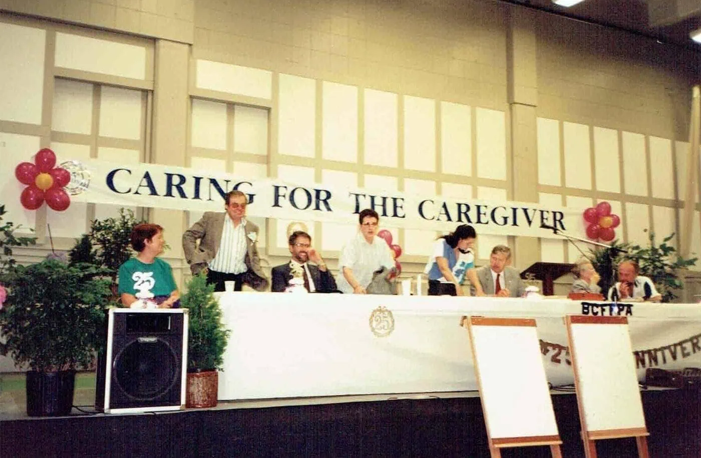 Speakers sit at a “Caring for the Caregiver” event.