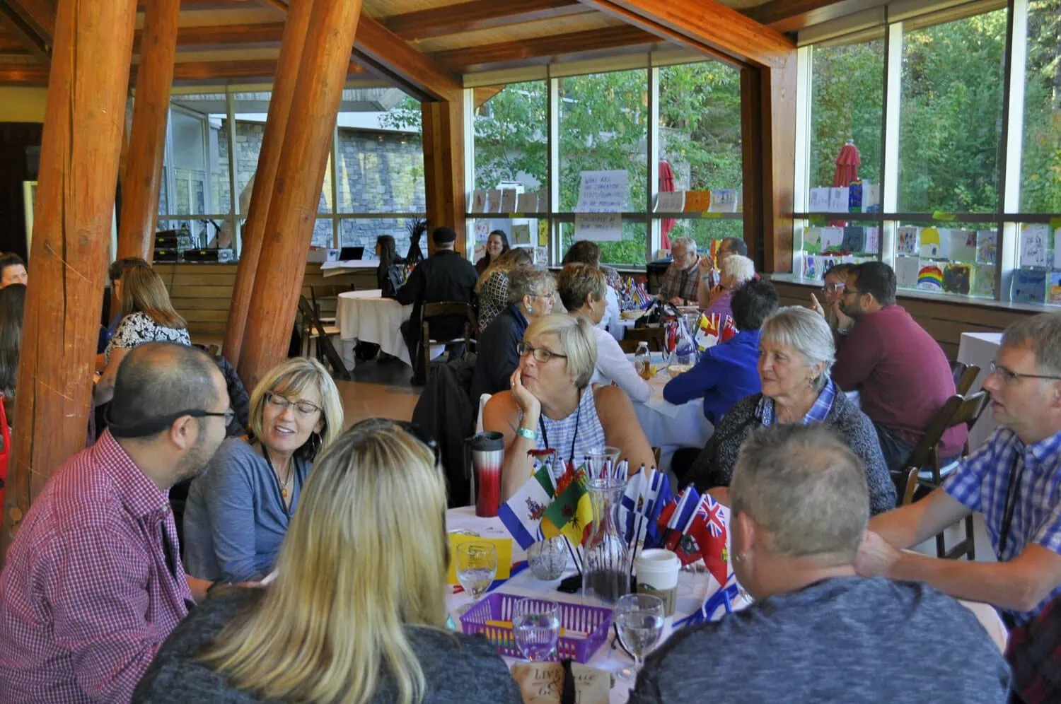 Attendees gather around tables during a BCFPA event.