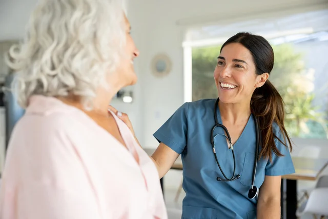 A nurse speaks with a patient.